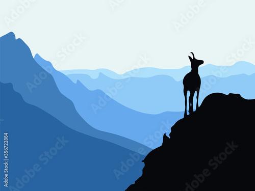 A chamois stands on top of a hill with mountains in the background. Black silhouette with blue background. Vector illustration. © Anna