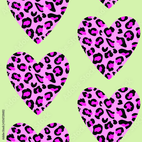 Pattern design of a animal print hearts on green background