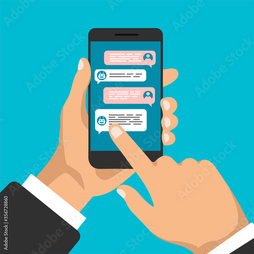 Chat bot. Hand holds smartphone with dialog boxes and click on it. Flat design of messaging bubbles. Chatting between robot and human. Vector illustration.