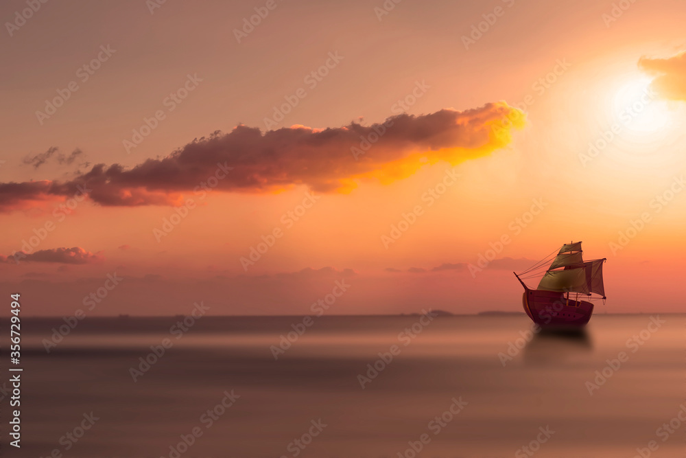 Lonely Ship before orange sunset with blurred water    