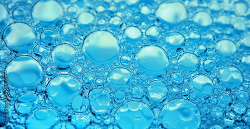 Abstract blue bubbles. Lather close-up texture. Soap suds macro background.