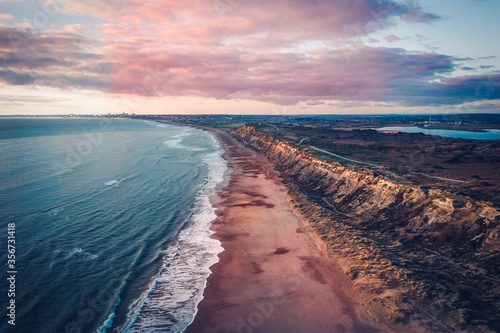 Aerial view of Hengistbury Head beach shore at sunset in Southbourne, Bournemouth, UK photo