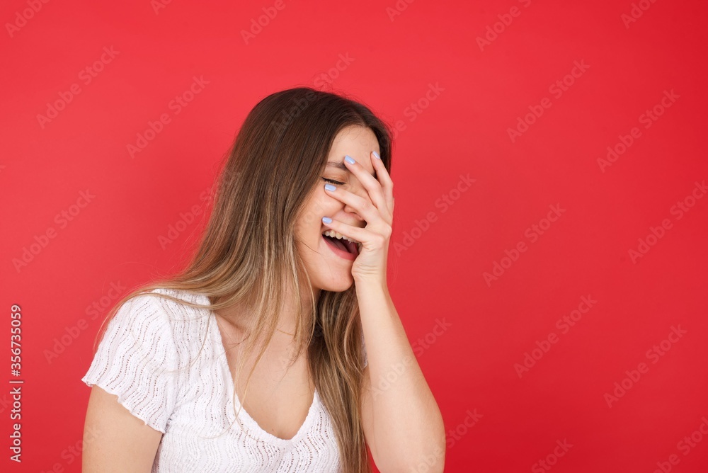 Charismatic carefree joyful friendly-looking outgoing woman likes laugh out loud not hiding emotions giggling hear funny hilarious joke chuckling facepalm close eyes smiling broadly white background Charismatic carefree joyful friendly-looking outgoing woman likes laugh out loud not hiding emotions giggling hear funny hilarious joke chuckling facepalm close eyes smiling broadly white background