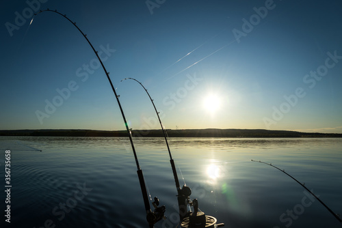 Trolling lake fishing at evening time