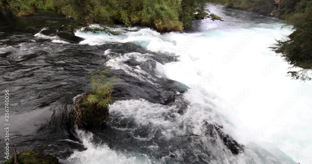 The wild white waters of Caburgua River flowing down and jumping at Carileufu waterfall. An amazing scenery inside the south of Chile rainforest at Pucon, an idyllic landscape for some relax time
The wild white waters of Caburgua River flowing down and jumping at Carileufu waterfall. An amazing scenery inside the south of Chile rainforest at Pucon, an idyllic landscape for some relax time