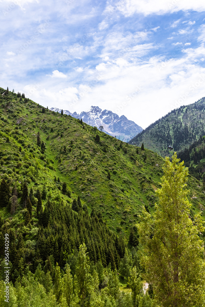 beautiful, bright, summer mountain landscape with a cable car. the concept of travel and recreation. beautiful, bright, summer mountain landscape with a cable car. the concept of travel and recreation.