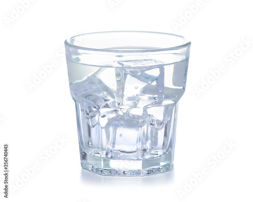 Glass of water with ice on white background isolation