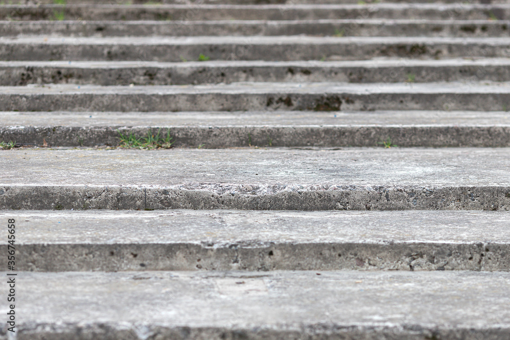 Old, wide and weathered gray concrete stairs structure. Stairway composition, texture, background Old, wide and weathered gray concrete stairs structure. Stairway composition, texture, background