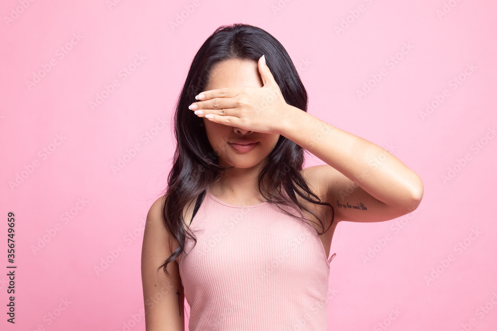 Young Asian woman close her eyes with hand. Young Asian woman close her eyes with hand.