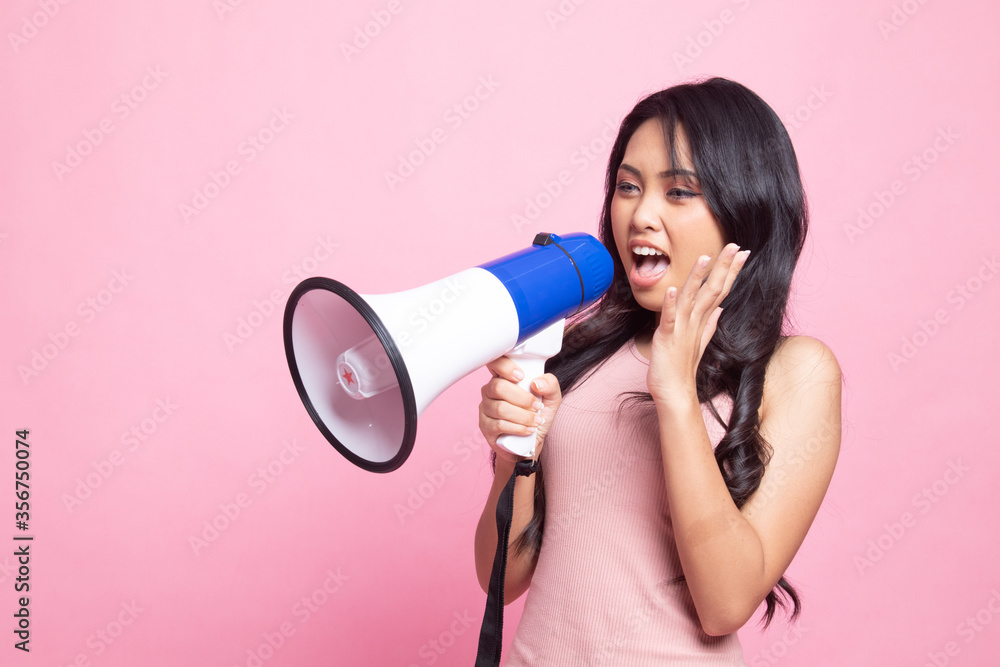 Beautiful young Asian woman announce with megaphone. Beautiful young Asian woman announce with megaphone.
