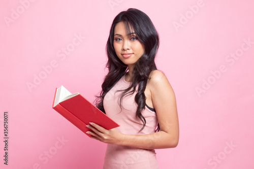 Young Asian woman with a book.