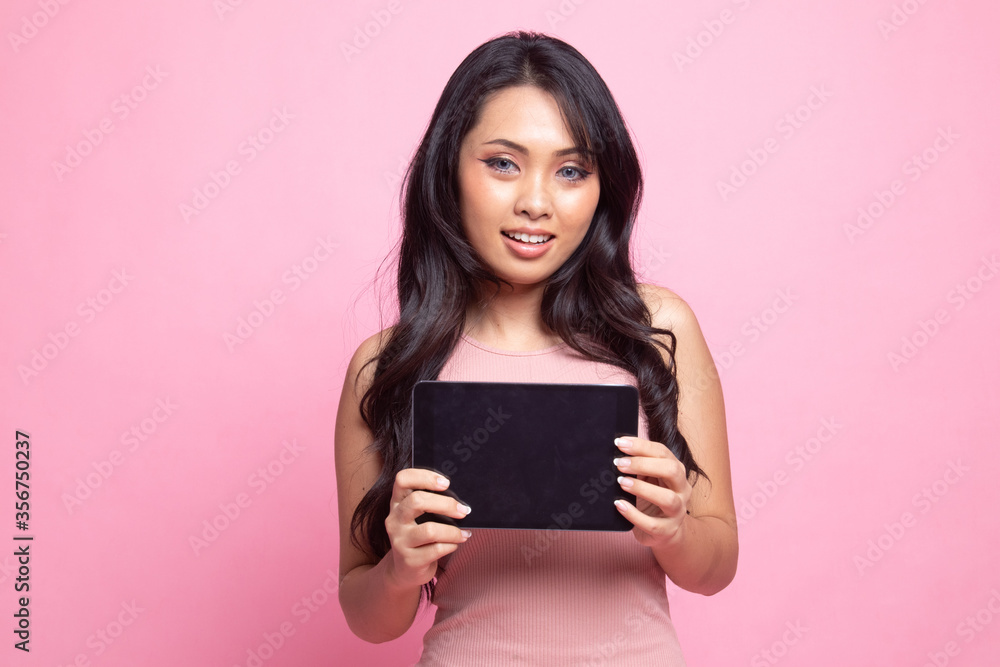 Young Asian woman with a computer tablet. Young Asian woman with a computer tablet.