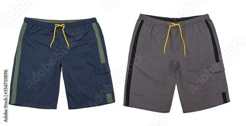 Pair of Summer men’s shorts on an elastic band with a yellow shoelace. Velcro side pocket. Color navy and taupe.