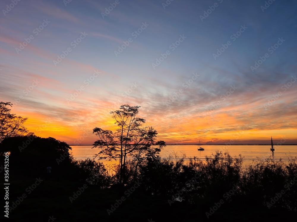 Naklejka premium Afternoon, background, beach, beautiful, beauty, boat, canoe, cloud, coconut tree, color, colorful, dawn, day, evening, foliage, green, heaven, horizon, lagoon, landscape, life, lifestyle, light, ligh