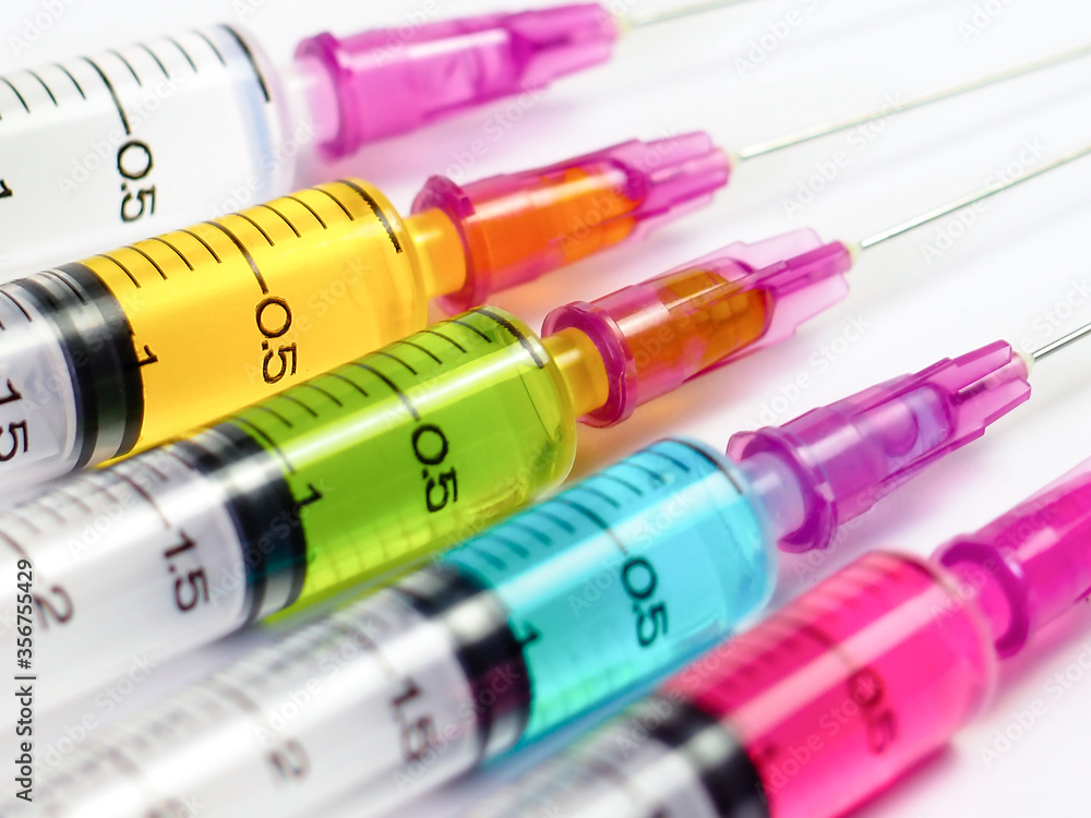 Syringe colourful closeup, Medication drug needle drug, medical concept flu shot vaccine dose hypodermic injection treatment disease care hospital prevention immunization illness disease. Syringe colourful closeup, Medication drug needle drug, medical concept flu shot vaccine dose hypodermic injection treatment disease care hospital prevention immunization illness disease.