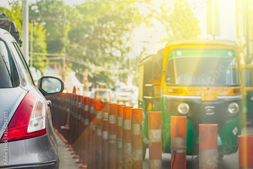 Street photography of Dividers with some vehicles in the Evening golden hours.