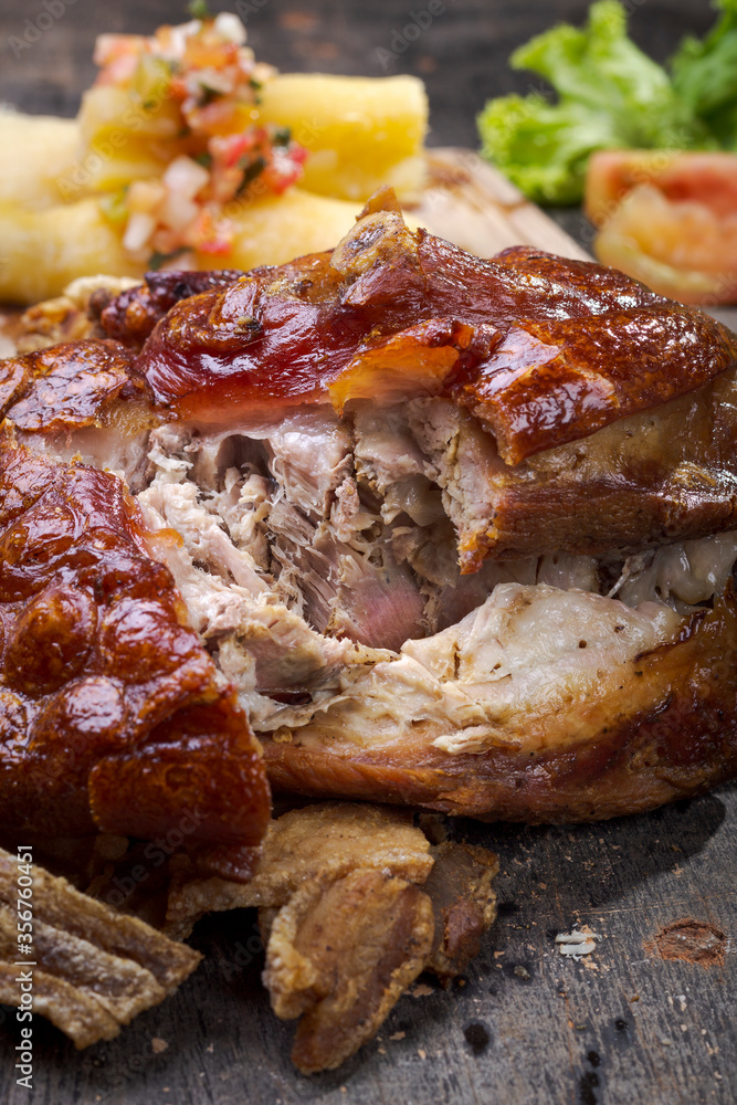 Typical Brazilian roasted pork knee with crackling vertical Typical Brazilian roasted pork knee with crackling vertical