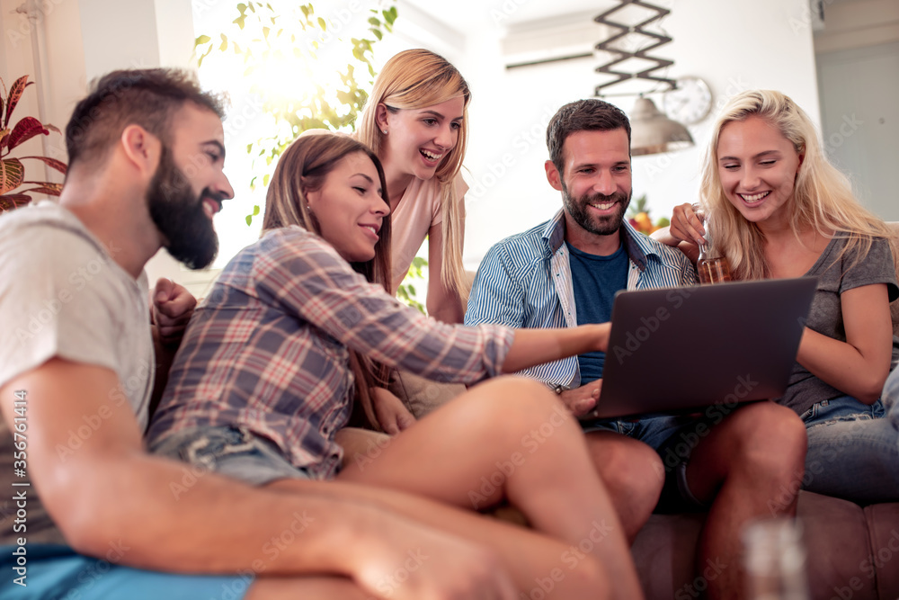 Group of friends watch movie on laptop. Group of friends watch movie on laptop.