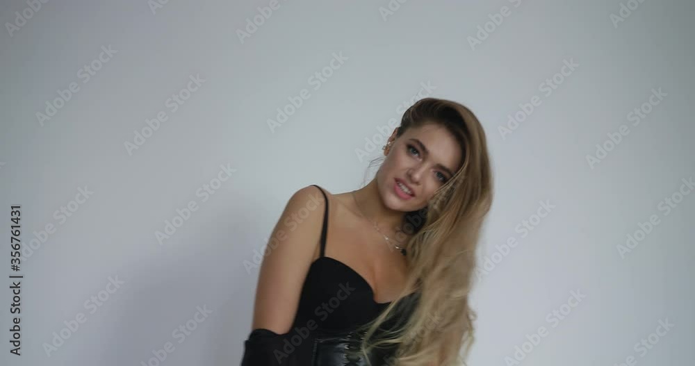 Attractive girl smiling waving her hair on a white background Attractive girl smiling waving her hair on a white background