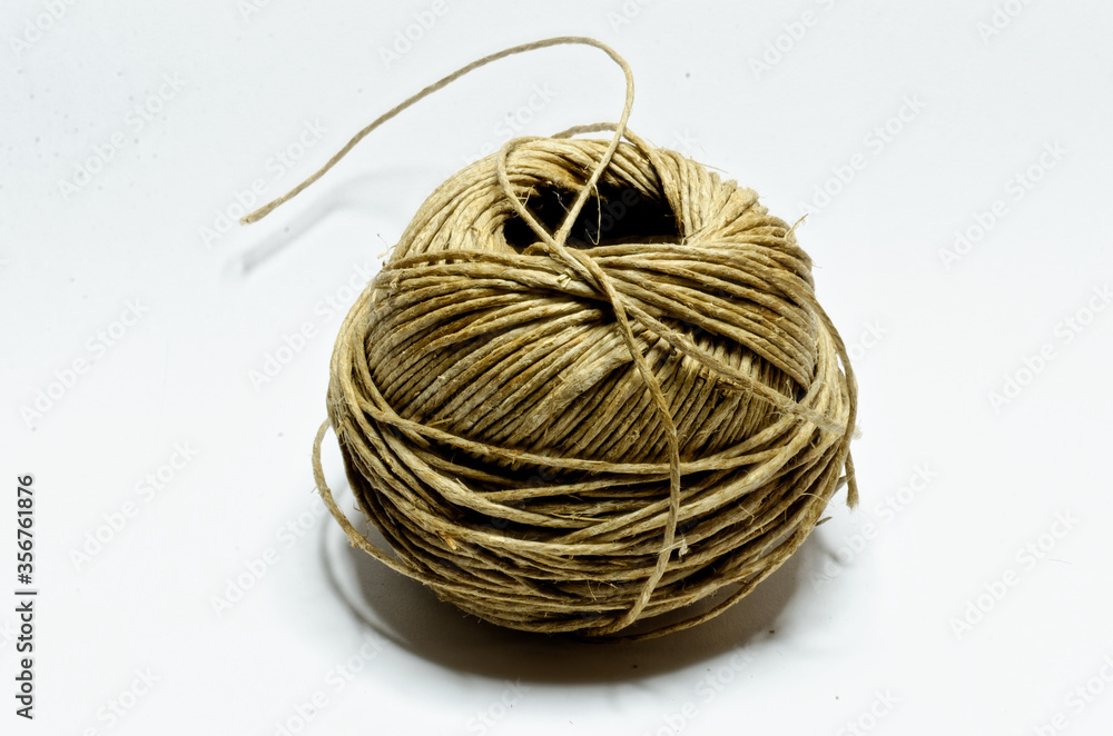 close up of a ball of string isolated on a white background close up of a ball of string isolated on a white background