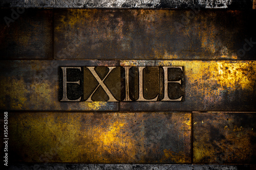Photos Photo of real authentic typeset letters forming text Exile on vintage textured s