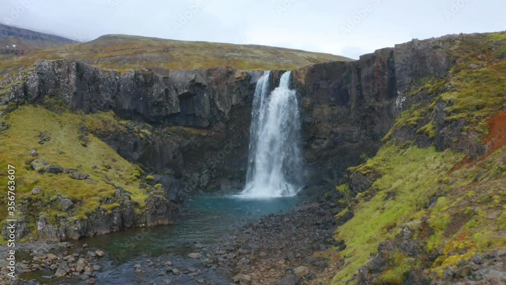 4k drone forward video (Ultra High Definition) of Gufufoss (Gufu Waterfall). Gloomy midnight sun scene of typical volcanic landscape of Iceland, Europe. Beauty of nature concept background. 4k drone forward video (Ultra High Definition) of Gufufoss (Gufu Waterfall). Gloomy midnight sun scene of typical volcanic landscape of Iceland, Europe. Beauty of nature concept background.