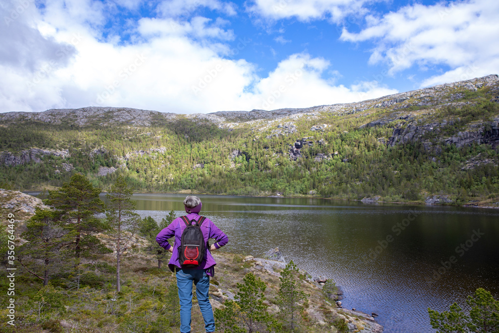 Happy women hiking on mountain lake, Nordland county