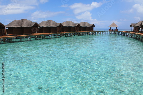 Houses on the water. Amazing Maldives. Beautiful clear water. © Vladyslava