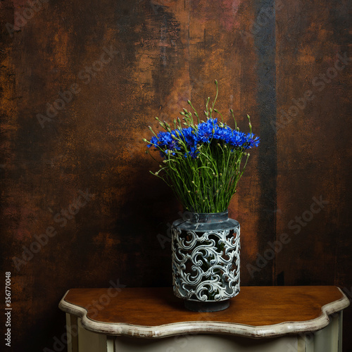 Fototapeta Naklejka Na Ścianę i Meble -  Summer beautiful wildflowers cornflowers in a vintage vase