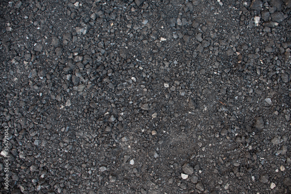 Texture small black stone. Road surface base Texture small black stone. Road surface base