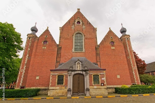 Facade of Saint John`s anglican church in Holy corner neighborhood, Ghent, Belgium on a cloudy day. 
