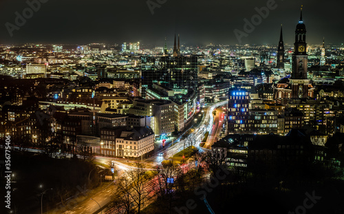 Hamburg cityscape by night featuring St. Michael's Church clock tower