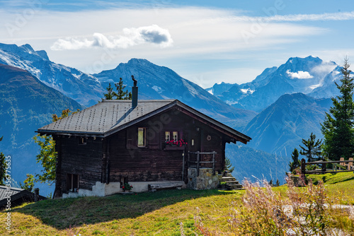 Idyllic landscape in Swiss Alps with chalet and mountains on background, Bettmeralp, Canton of Valais, Switzerland