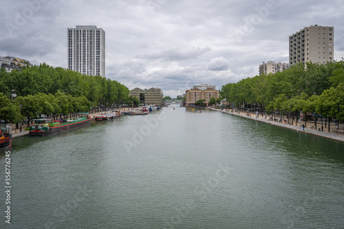Paris, France - 06 07 2020: View of Bassin de la Villette and the outdoor swimming pool from the lifting bridge of Flanders