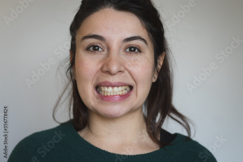 showing teeth gesture woman photo