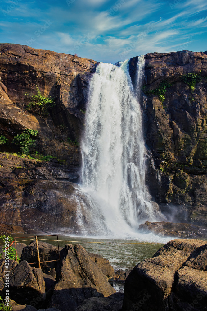 A close up shot of waterfall named Athirapally