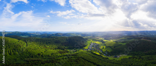 a forest landscape in the evening from above as high definition panorama