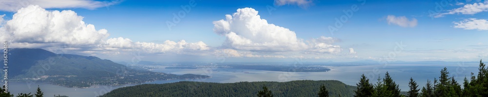 Beautiful Panoramic Canadian Landscape view from top of Mt. Gardener Hike with Vancouver City in Background. Located in Bowen Island, British Columbia, Canada.