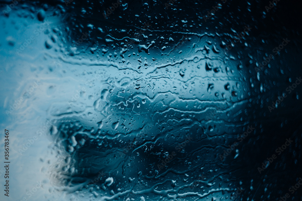 Obraz premium water drops on glass, window glass with condensation
