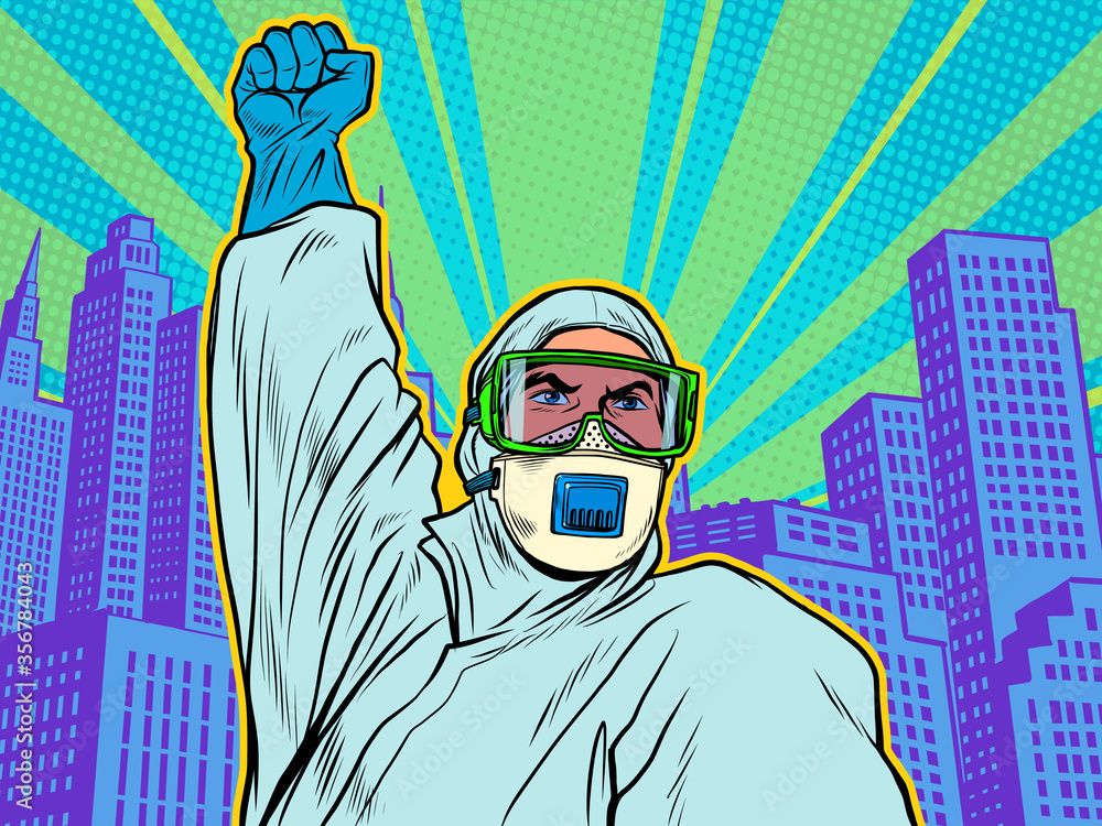 A doctor in a full protection suit. Resistance gesture. Epidemic coronavirus covid19 A doctor in a full protection suit. Resistance gesture. Epidemic coronavirus covid19
