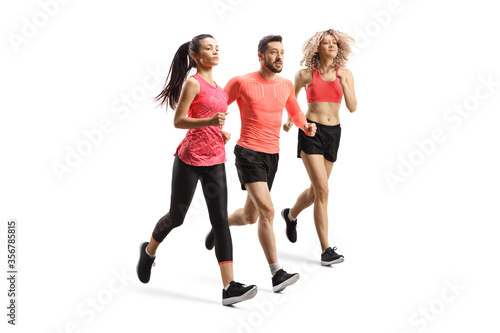 Full length shot of a man and two women in sportswear running a race