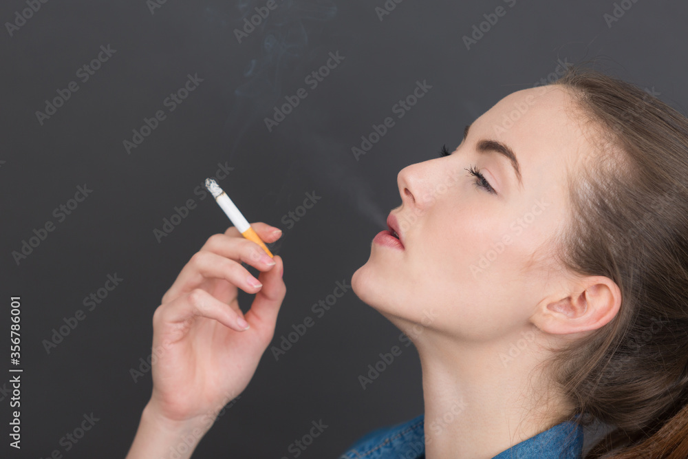 Fototapeta premium portrait of a girl with a cigarette