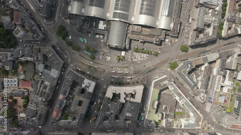 AERIAL: High Overhead Top Down Birds View Shot of Frankfurt am Main, Germany Central Train Station in Summer, City Streets with Public Transport Tram and Infrastructure AERIAL: High Overhead Top Down Birds View Shot of Frankfurt am Main, Germany Central Train Station in Summer, City Streets with Public Transport Tram and Infrastructure