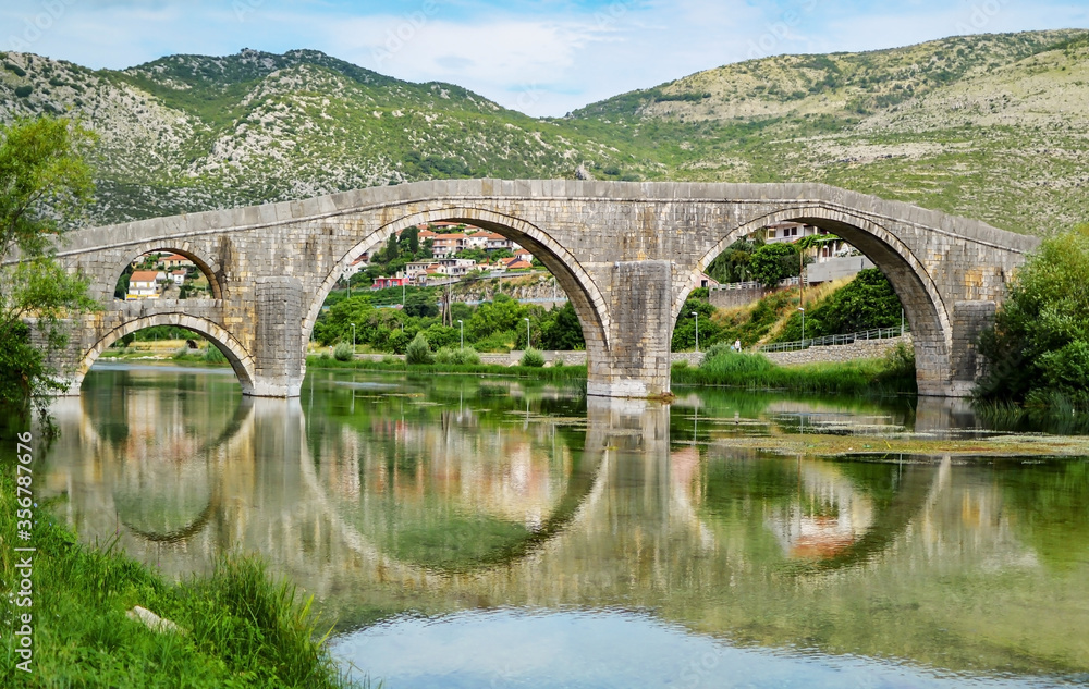 Old stone made Perovica Arslanaginica Bridge over river Trebisnjice in Trebinje, Bosnia and Herzegovina.