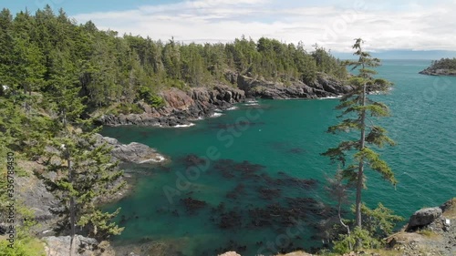 A aerial drone shot of the beautiful coastline with turquoise water near Sooke, BC. 4K 24FPS.