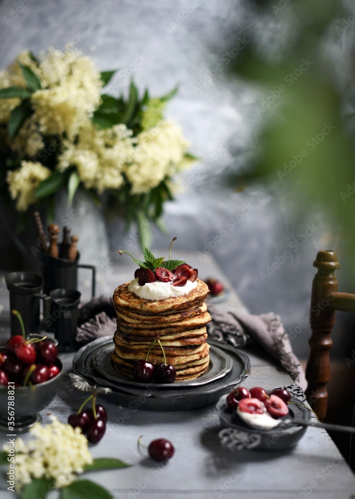  Breakfast Pancakes with  Cherries, Homemade American pancakes served withfresh cherry on a wooden background, sweet dessert 