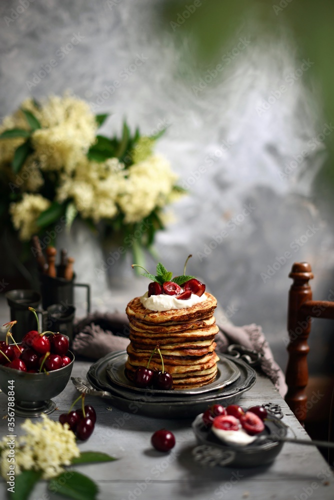 Breakfast Pancakes with Cherries, Homemade American pancakes served withfresh cherry on a wooden background, sweet dessert Breakfast Pancakes with Cherries, Homemade American pancakes served withfresh cherry on a wooden background, sweet dessert
