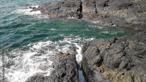 A aerial drone shot of the beautiful coastline with turquoise water near Sooke, BC. 4K 24FPS.