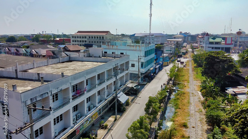 MAEKLONG, THAILAND - DECEMBER 15, 2019: Aerial view of Maeklong railway market and city skyline photo