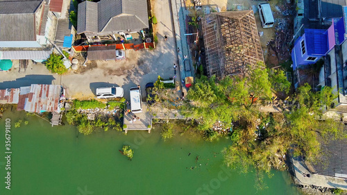 Aerial view of Maeklong railway market and city skyline, Thailand photo